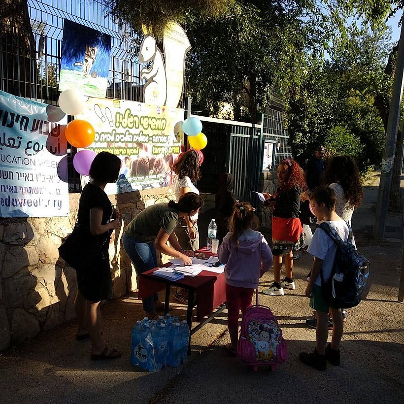 Local SUNRISE volunteers engaging with the community in the Baka